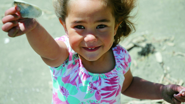 Maori girl with shell