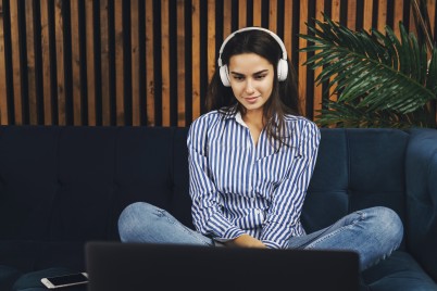 Young girl watching programme on laptop - screentime 